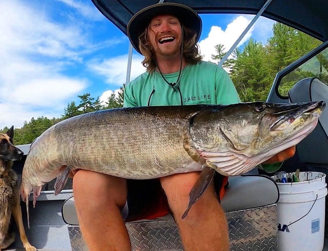 Man holding fish on boat