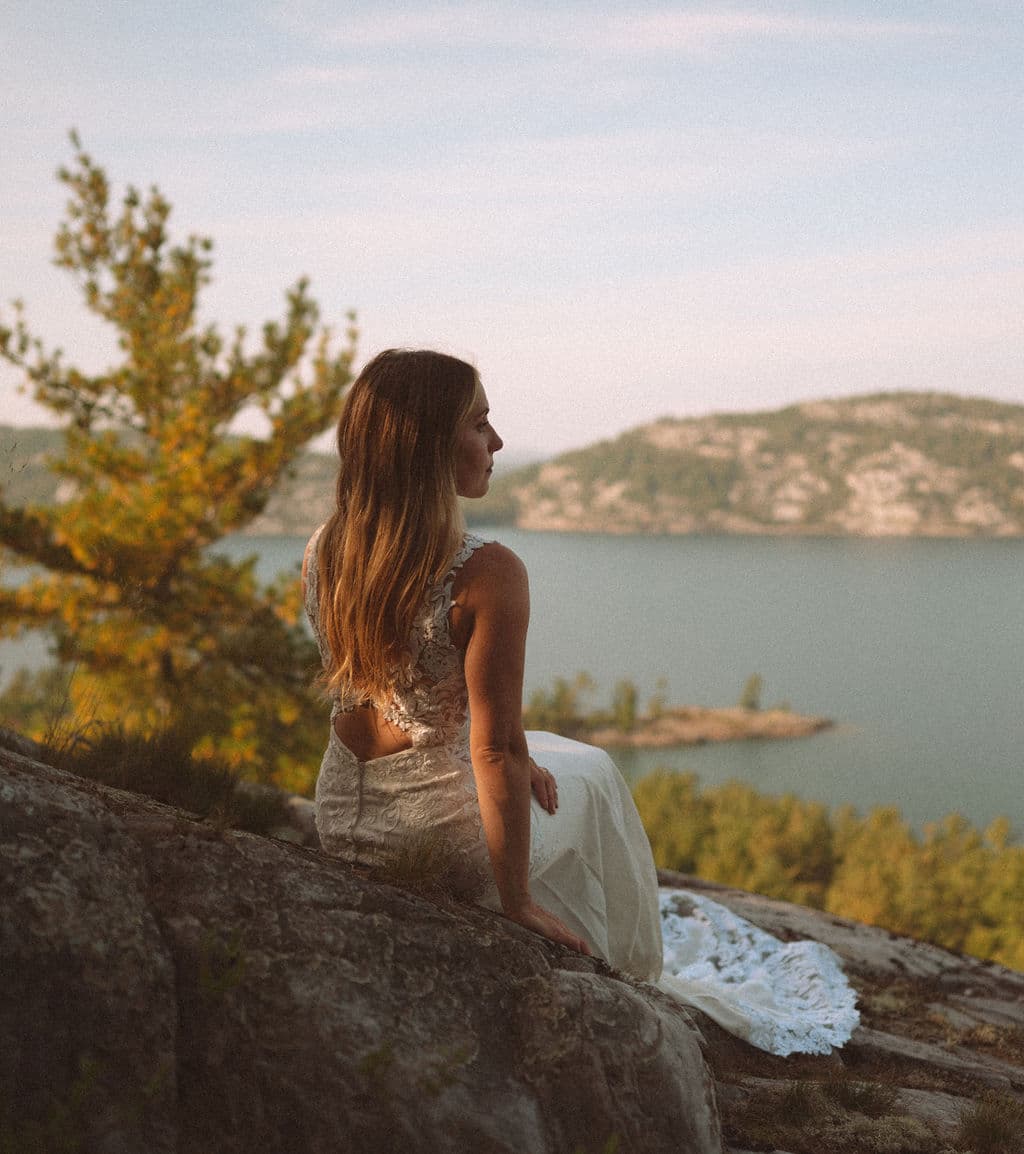 Bride lounging on rocks